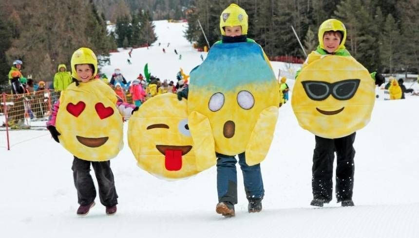 Carnival time in Alta Badia, Dolomites in Italy- fun on the slopes in colorful masks and traditional food 